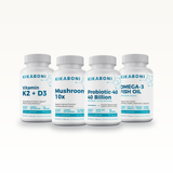 Immune Support Stack: front view of four Kikaboni supplement bottles lined up on white background.